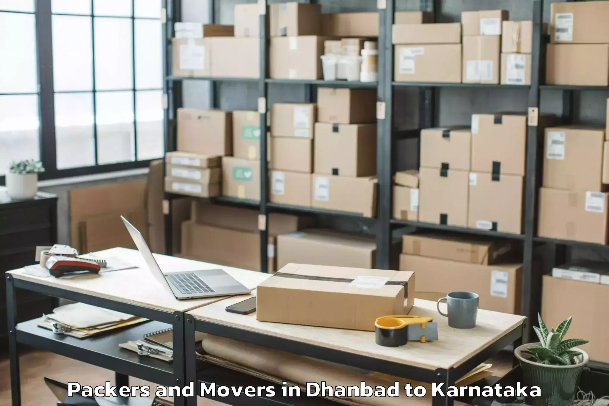 Reliable Dhanbad to Karnataka State Law University Packers And Movers